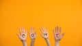 Come written palms on orange background, activist hands, project presentation