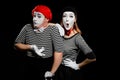 Comedy sketch of mimes. Waist up portrait of man and woman Royalty Free Stock Photo