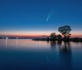 Comet C/2020 F3 Neowise in night sky above Dnieper river, Ukraine