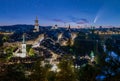 Comet C/2020 F3 Neowise in night sky over old town of Bern, Switzerland at twilight Royalty Free Stock Photo