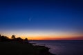 Comet NEOWISE in the starry night sky after sunset with the beach and ocean. Denmark Royalty Free Stock Photo