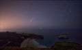 Comet NEOWISE streaking through the sky above the ocean from the Cantabrian sea Royalty Free Stock Photo