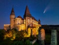 Comet in night sky over Corvin Castle, Hunedoara, Transylvania, Romania