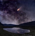 Comet over mountain lake