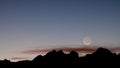 Comet Panstarrs and slim crescent moon above a ridge of sandstone at Sand Hollow reservoir in Hurricane Utah b Royalty Free Stock Photo