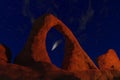 Comet in the sky, view through orange rock