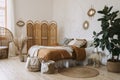 Comfort apartment in bohemian style interior with hygge bedroom Royalty Free Stock Photo