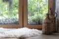 Sheepskin rug and home decor on wooden windowsill Royalty Free Stock Photo