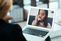 Comfort is just a video call away. Shot of a young woman having a counselling session with a psychologist using a video Royalty Free Stock Photo