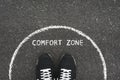 Comfort zone concept. Feet standing inside comfort zone circle Royalty Free Stock Photo
