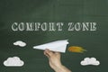 Comfort Zone Concept, Human hand holding paper airplane on chalkboard Royalty Free Stock Photo