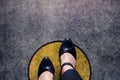 Comfort zone concept, woman with leather shoes steps over circle Royalty Free Stock Photo