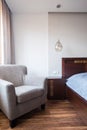 Comfortable armchair and bed Royalty Free Stock Photo