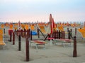 Comfortable beach with sun beds and orange umbrellas Royalty Free Stock Photo