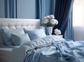 A comfortable bed with blue linen at home, a bedroom in a blue tone, comfort. Royalty Free Stock Photo