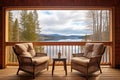 comfortable chairs on a cabin porch with lake view