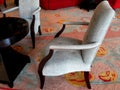 A comfortable coffee table and 2 grey chairs