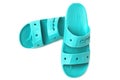 Comfortable Crocs sandals on white background. Rubber sandals, trendy beach shoes