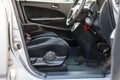 Comfortable front seats inside the car: the driver and passenger, tied in blue check velor, of an old secondhand Japanese sedan Royalty Free Stock Photo