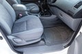 Comfortable front seats inside the car: the driver and passenger, tied with genuine black leather, modern interior design, the