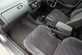 Comfortable front seats inside the car: the driver and passenger, tied with genuine black leather, modern interior design, the