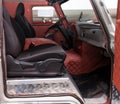 Comfortable front seats inside the  truck car: the driver and passenger, tied with red leather, vintage interior design, the Royalty Free Stock Photo