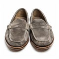 Comfortable grey suede loafers with penny strap detail, isolated on white background. Royalty Free Stock Photo