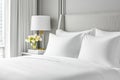 Comfortable hotel room with perfectly made bed and decorative pillows Royalty Free Stock Photo
