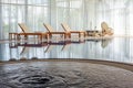 Comfortable indoor swimming pool with jacuzzi, chaise lounges, massage bed and rocking chair in country house