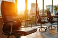 Comfortable leather office chair in a modern office at sunset Royalty Free Stock Photo