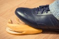 Leather shoe before slipping on banana peel Royalty Free Stock Photo