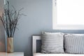 Comfortable living room, grey pillow on sofa with window, copy space. Royalty Free Stock Photo