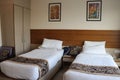 Comfortable mattress and pillows at the budget hotel room. Online hotel booking is a big tourist contributor.