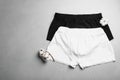 Comfortable men`s underwear and cotton flowers on grey stone background, flat lay Royalty Free Stock Photo