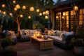 comfortable patio seating area with lit lanterns