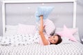 Comfortable pillow. Girl smiling child lay bed star pattern pillows and plaid bedroom. Bedclothes for children. Girl kid Royalty Free Stock Photo