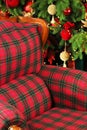 A comfortable red chair. Loft style. Christmas miracles. New Year`s interior. Cristmas Royalty Free Stock Photo