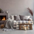 Comfortable shite sofa with cushions and plaid near side table with burning candles. Scandinavian interior design