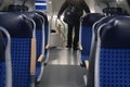 Comfortable soft blue seats with headrests in half-empty train car in Germany, concept of long-distance travel, ticket for Royalty Free Stock Photo