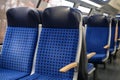 Comfortable soft blue seats with headrests in a train car in Germany Royalty Free Stock Photo