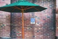 Comfortable sunshade and permitted information signage for smokers