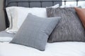 Comfortable white and grey pillow on bed Royalty Free Stock Photo