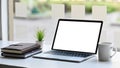 Comfortable workplace. Computer laptop with white blank screen putting together with Coffee cup, Notebook, Diary and Potted plant. Royalty Free Stock Photo