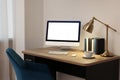 Comfortable workplace at home. Modern computer with blank screen and lamp on wooden desk. Mockup for design Royalty Free Stock Photo