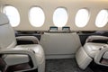 Comfortible cabin chairs in a modern business jet aircraft durin Royalty Free Stock Photo