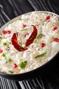 Comforting Curd Rice is a popular dish from South India with yogurt and then tempered with spices closeup in a plate. Vertical Royalty Free Stock Photo