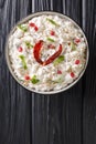 Comforting Curd Rice is a popular dish from South India with yogurt and then tempered with spices closeup in a plate. Vertical top Royalty Free Stock Photo