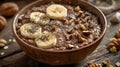 Plantbased dish with oatmeal, bananas, nuts, and chia seeds on a wooden table Royalty Free Stock Photo