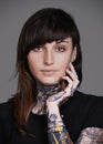 Comfotable in my own skin. A cropped studio portrait of a beautiful tattooed young woman. Royalty Free Stock Photo