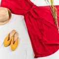 Comfotable yellow sandals matches with red trendy dress and straw hat Royalty Free Stock Photo